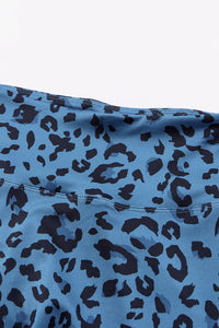 Blue fabric with black leopard print pattern