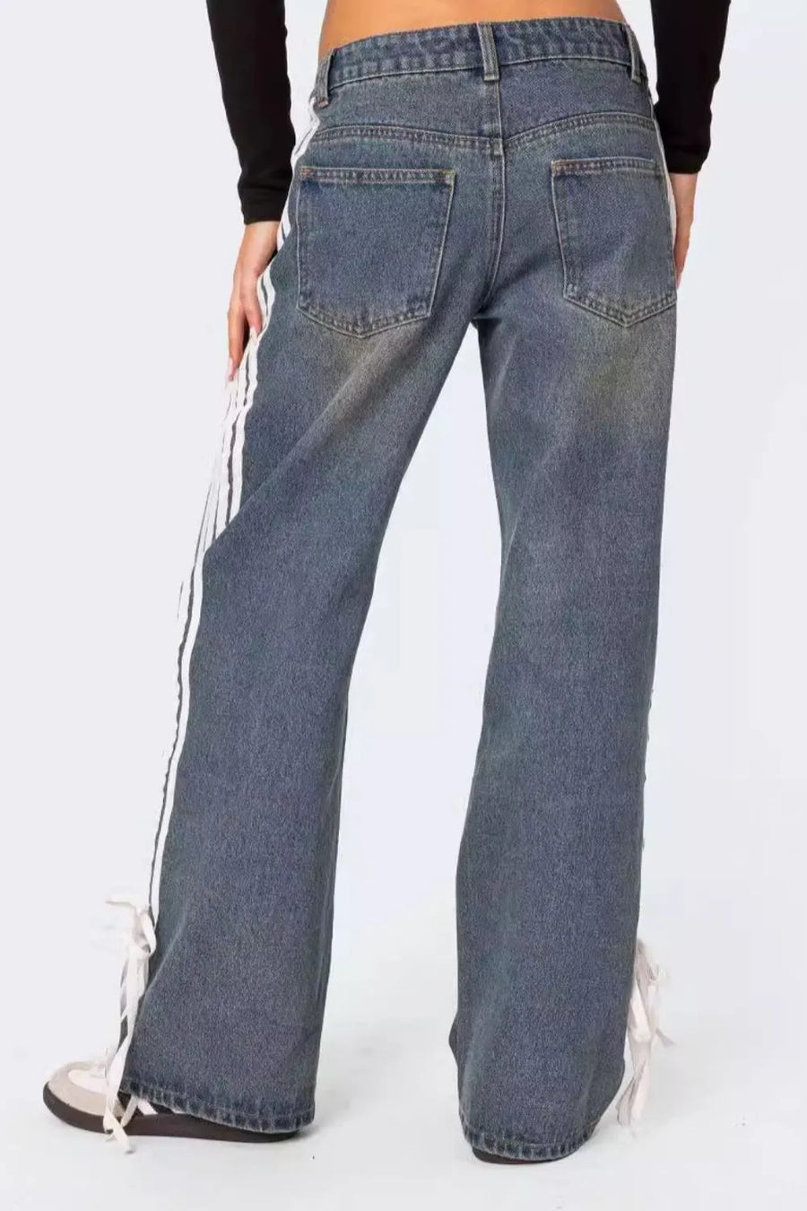 Blue jeans with white stripes on a white background