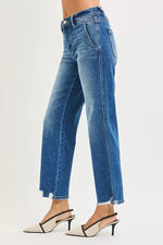 Blue jeans worn by a person on a white background