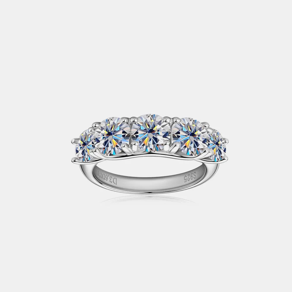 Silver ring with multiple gemstones on a white background