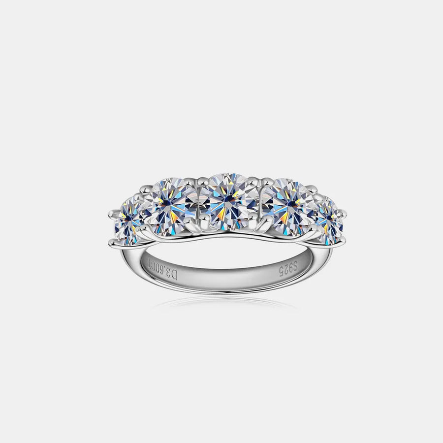 Silver ring with multiple gemstones on a white background
