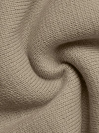 Close-up of beige fabric with a textured pattern