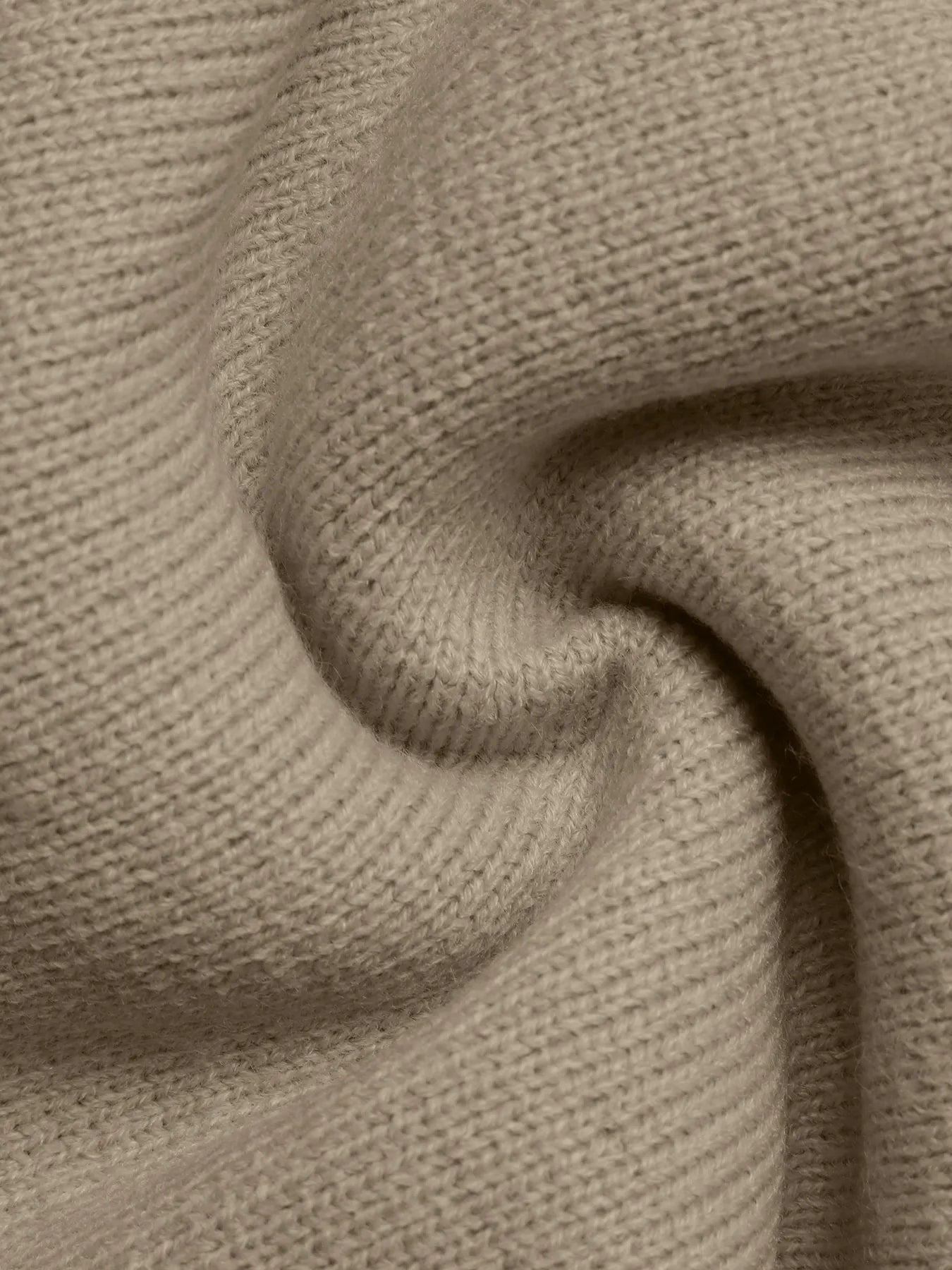 Close-up of beige fabric with a textured pattern