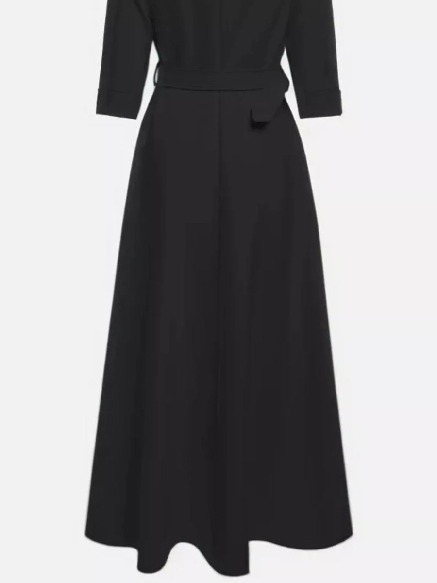 Black dress with a belt on a white background