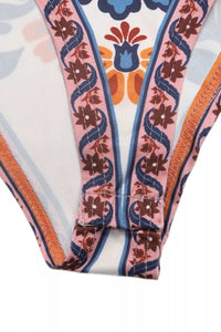 Close-up of a swimsuit with a colorful pattern on a white background