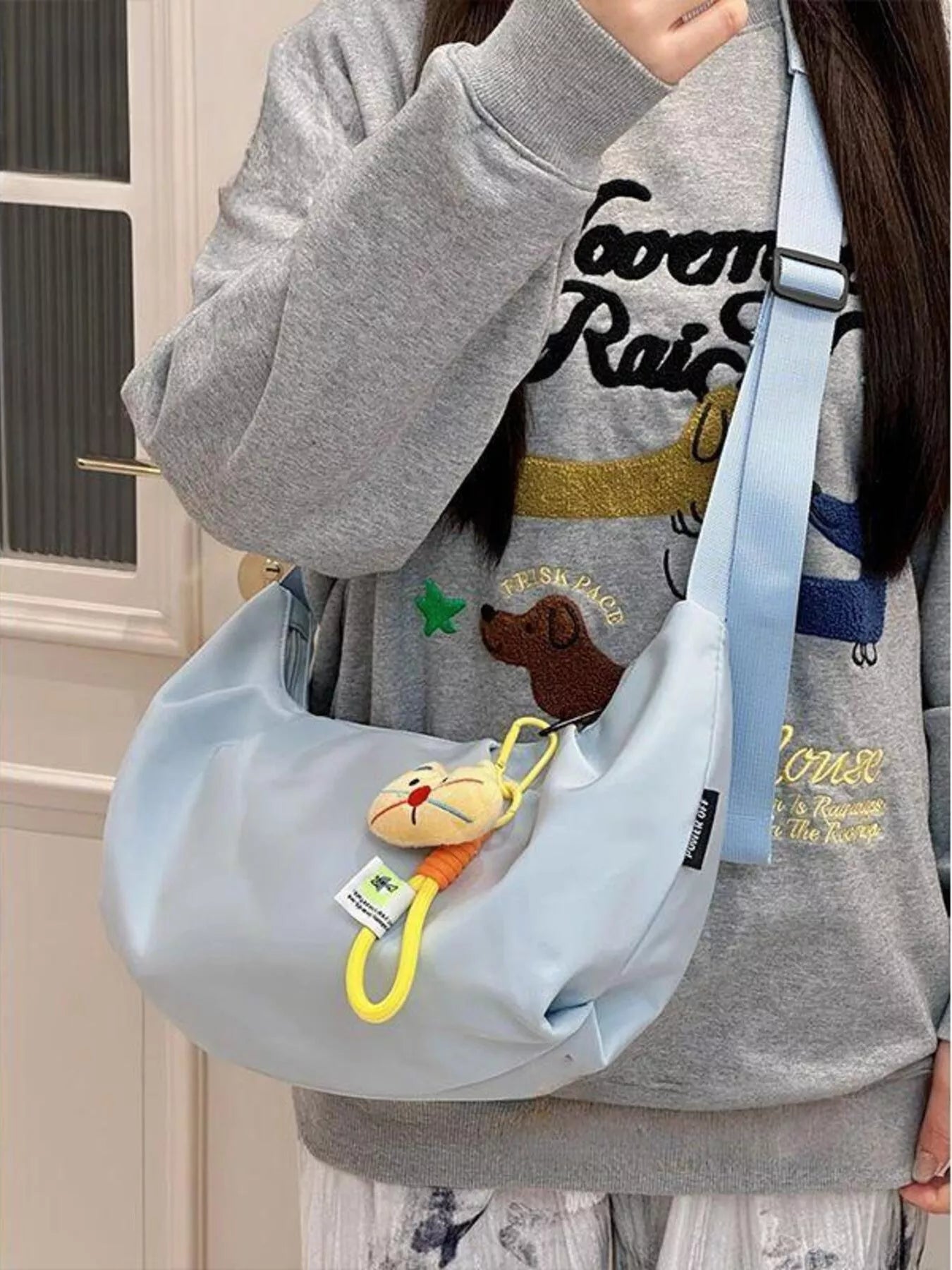 Young girl carrying  blue Adjustable Strap Crossbody Bag Purse
