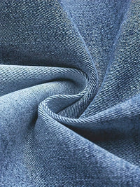 Close-up of blue denim fabric with visible texture