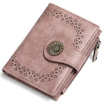 Pink wallet with decorative button on a white background
