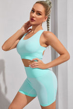 Woman wearing a light blue dress against a plain background