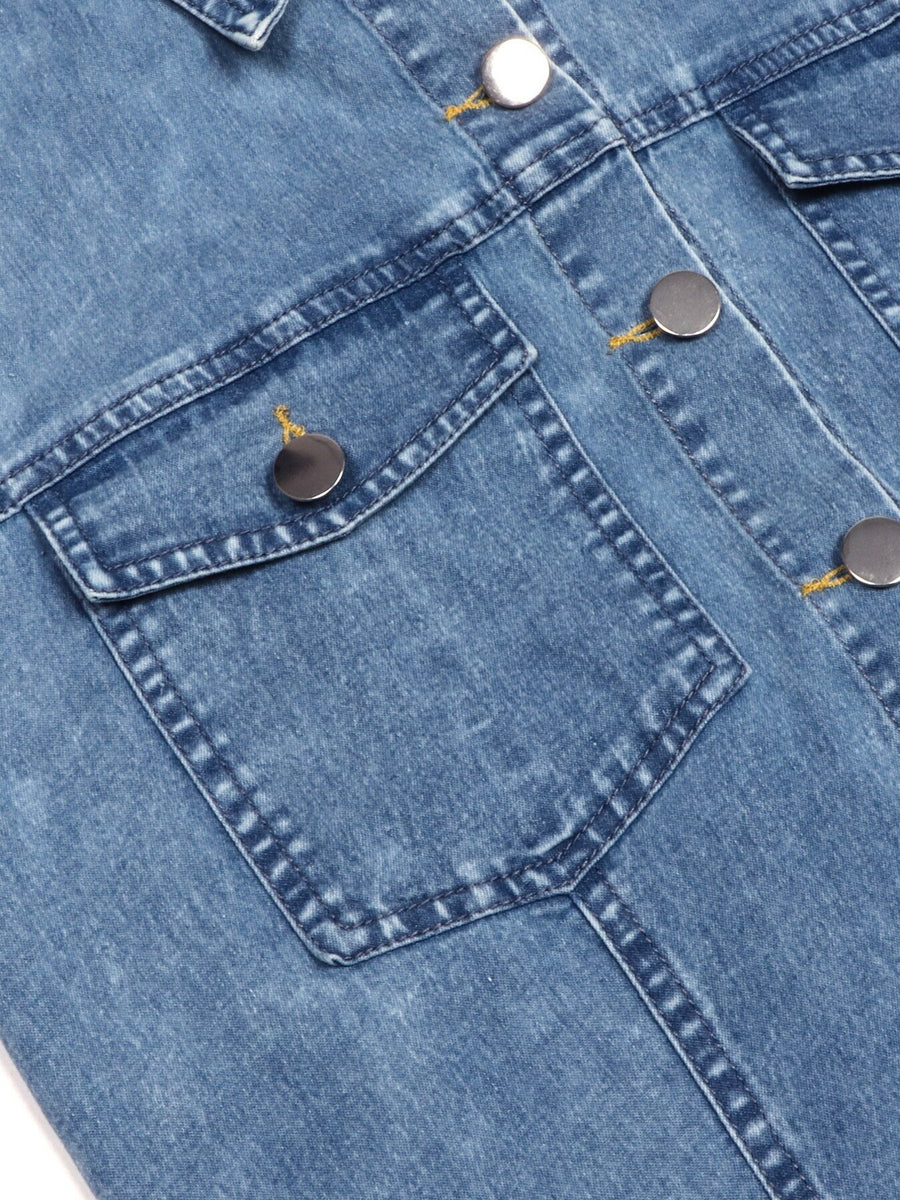 Close-up of a blue denim jacket with button details
