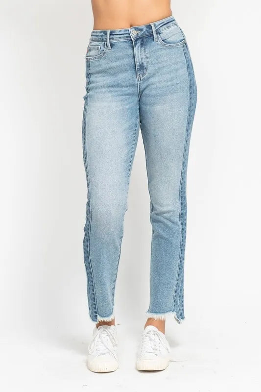 Light blue jeans worn by a person on a white background