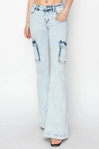 Light blue jeans with distressed details on a white background