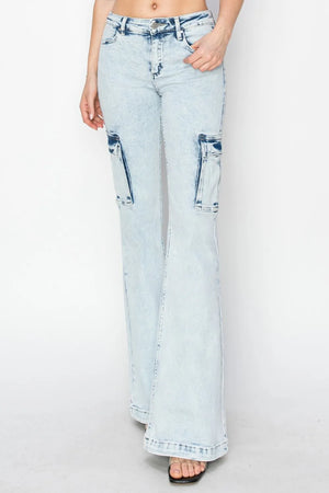 Light blue jeans with distressed details on a white background