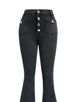Black jeans with button details on a white background