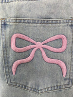 A close up view of the design on the back pocket Washed Wide Leg Jeans
