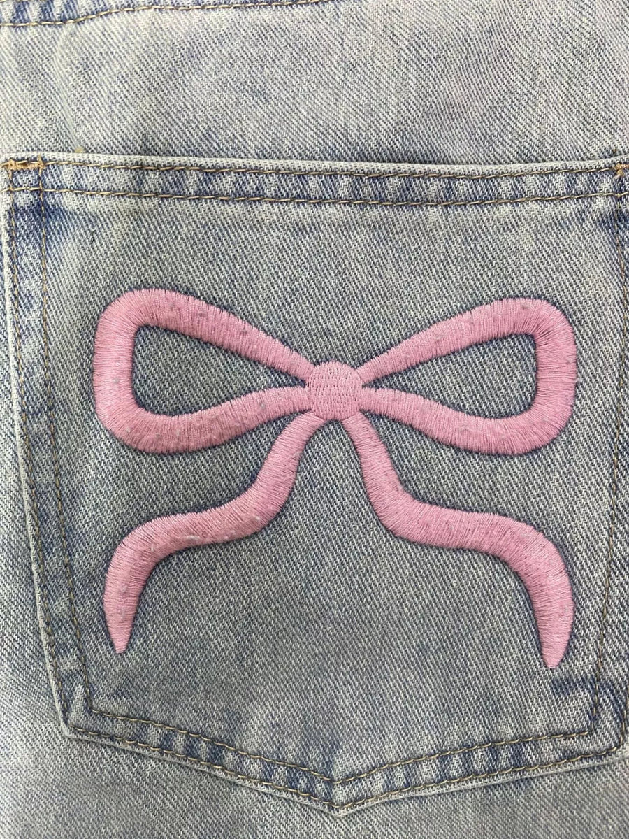 A close up view of the design on the back pocket Washed Wide Leg Jeans