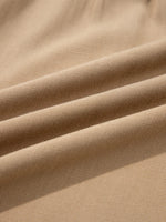 Close-up of beige fabric with visible texture
