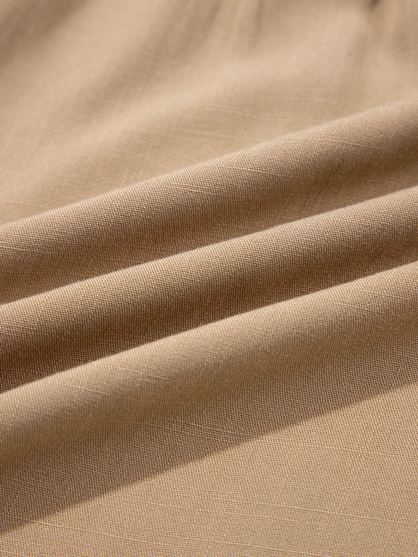 Close-up of beige fabric with visible texture
