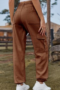 Brown cargo pants worn by a person in an outdoor setting