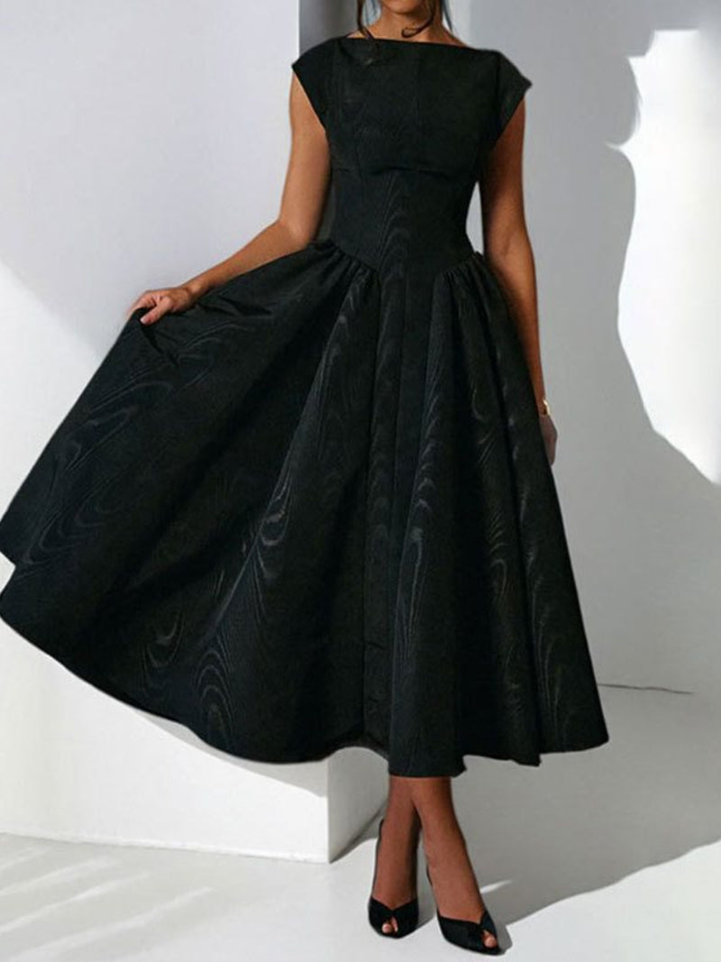 Black dress with a subtle pattern on a white background