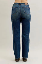 Blue jeans on a plain background