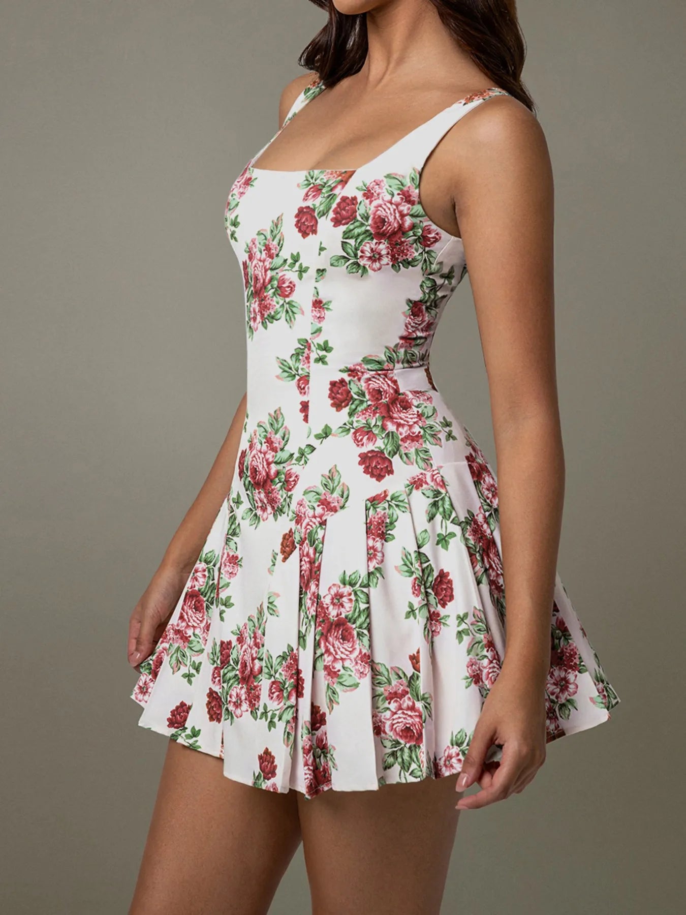 Floral dress with red and green flowers on a plain background