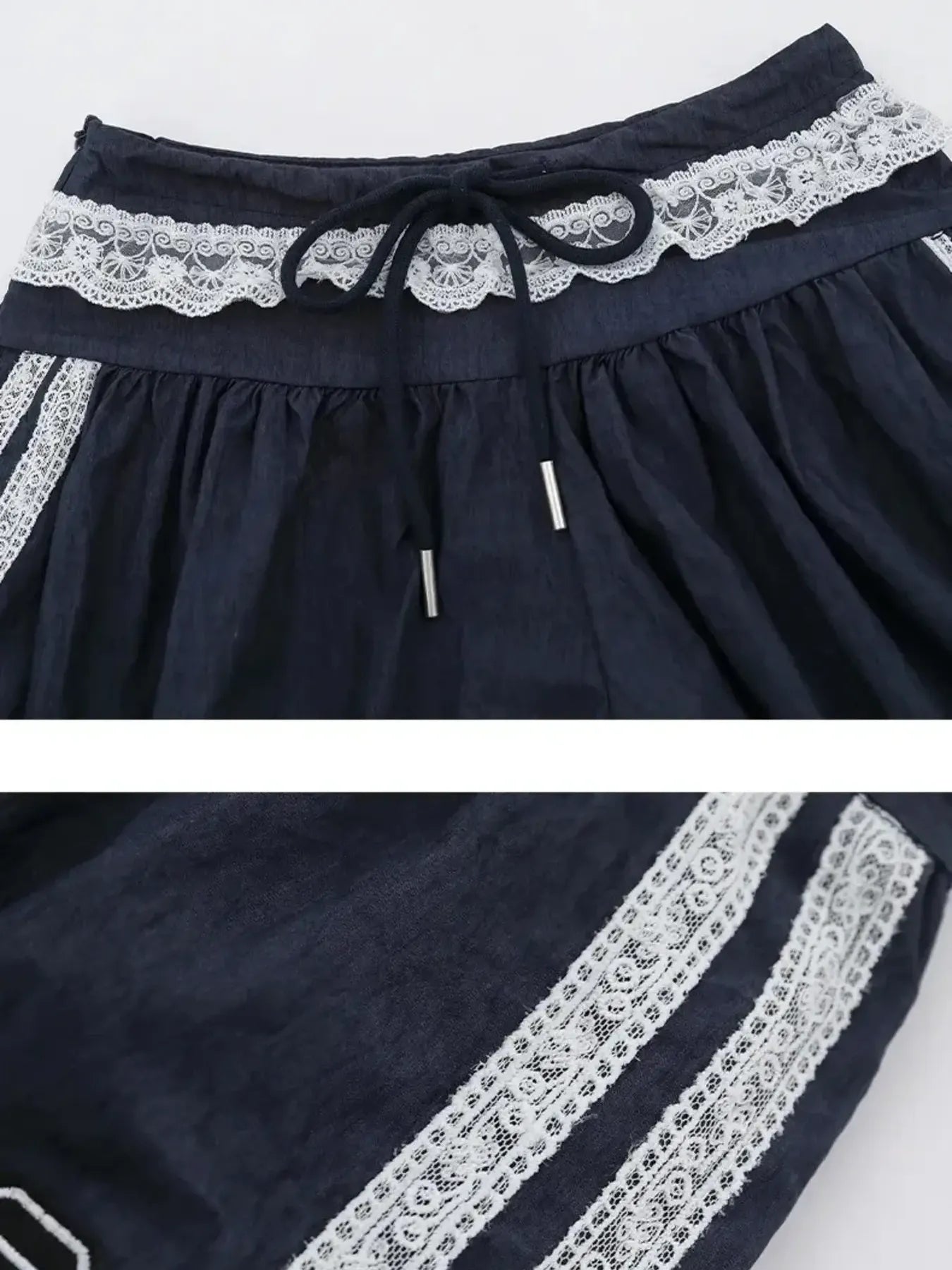 Navy blue fabric with white lace trim on a white background