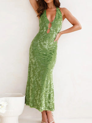 Green lace dress worn by a model on a white background