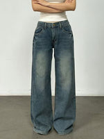 Person wearing wide-leg jeans against a plain background