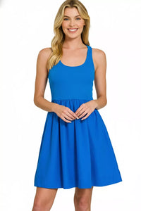 Woman wearing a blue dress on a white background