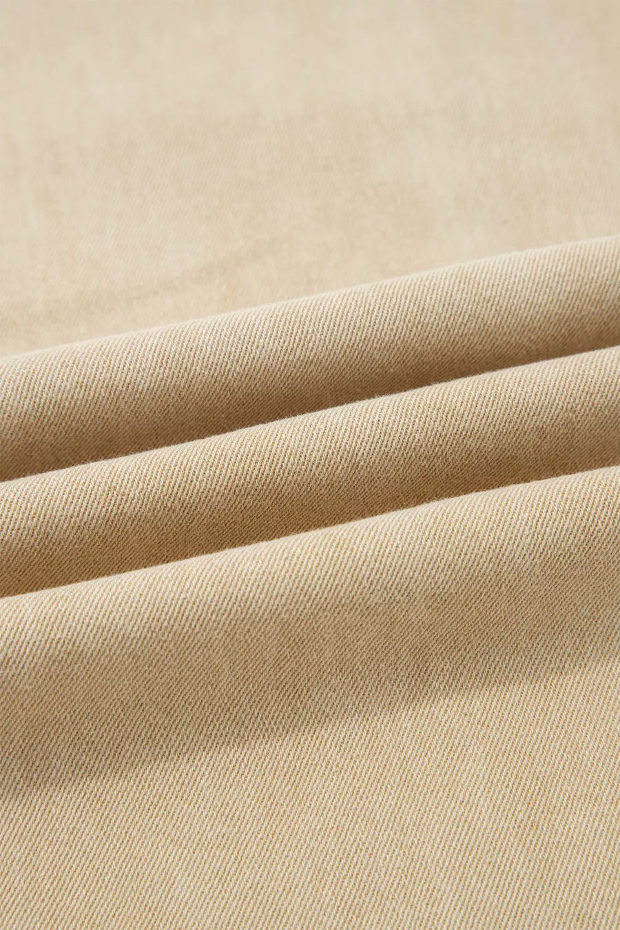 Close-up of beige fabric with folds