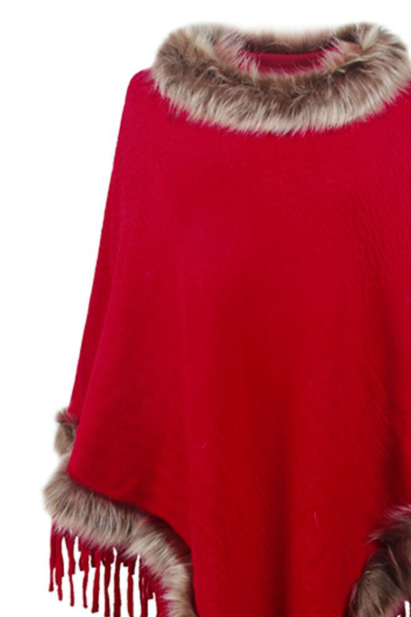 Red poncho with fur trim on a white background