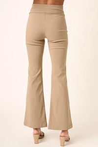 Beige flared pants on a white background