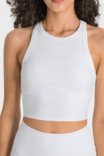 White athletic top worn by a person on a white background