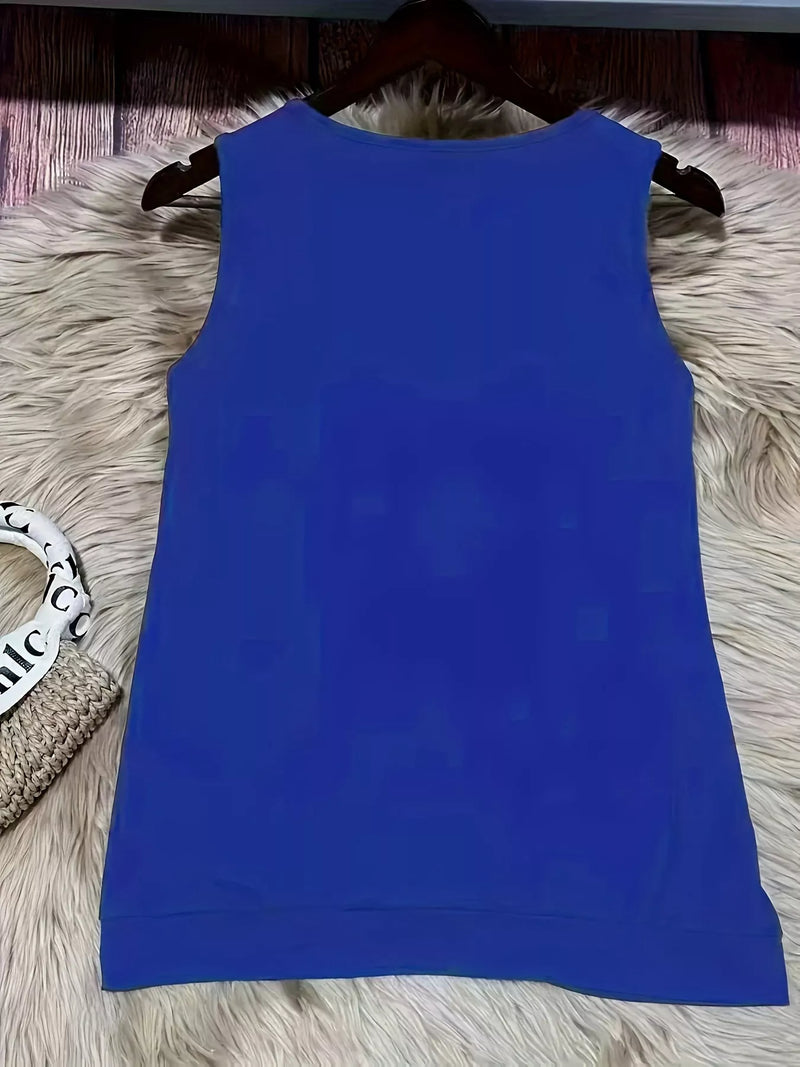 Blue sleeveless top on a hanger against a textured surface