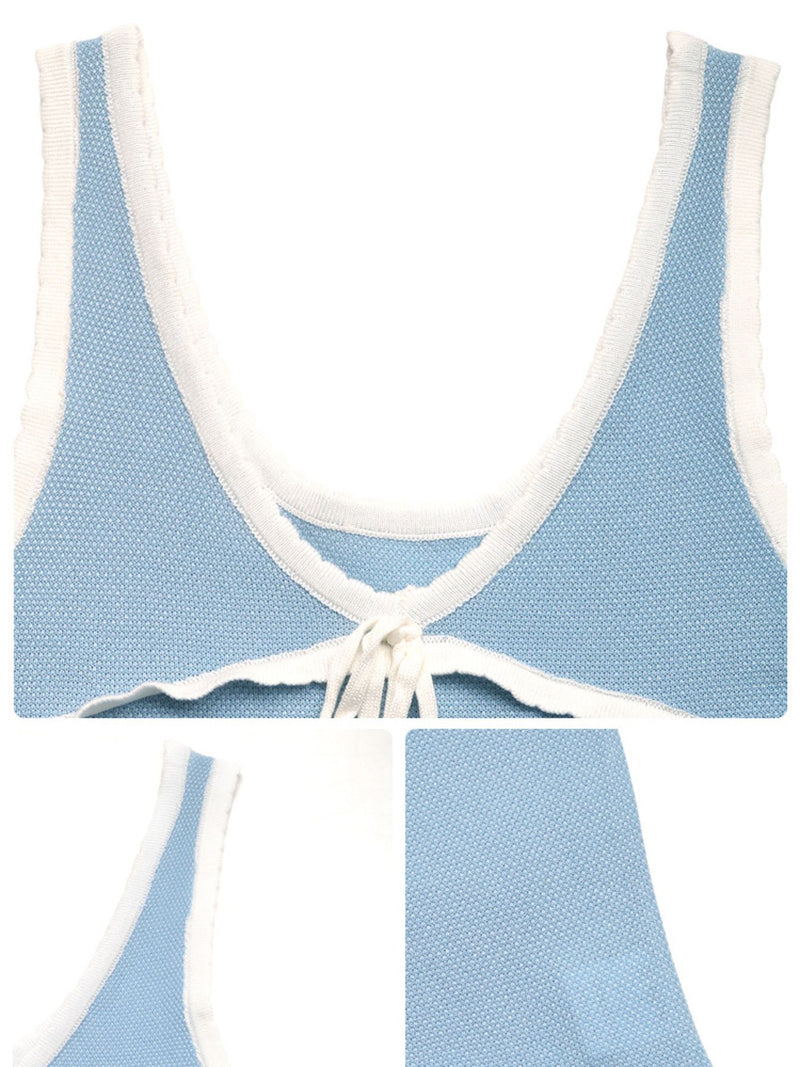 Light blue and white patterned top with a tie detail on a white background