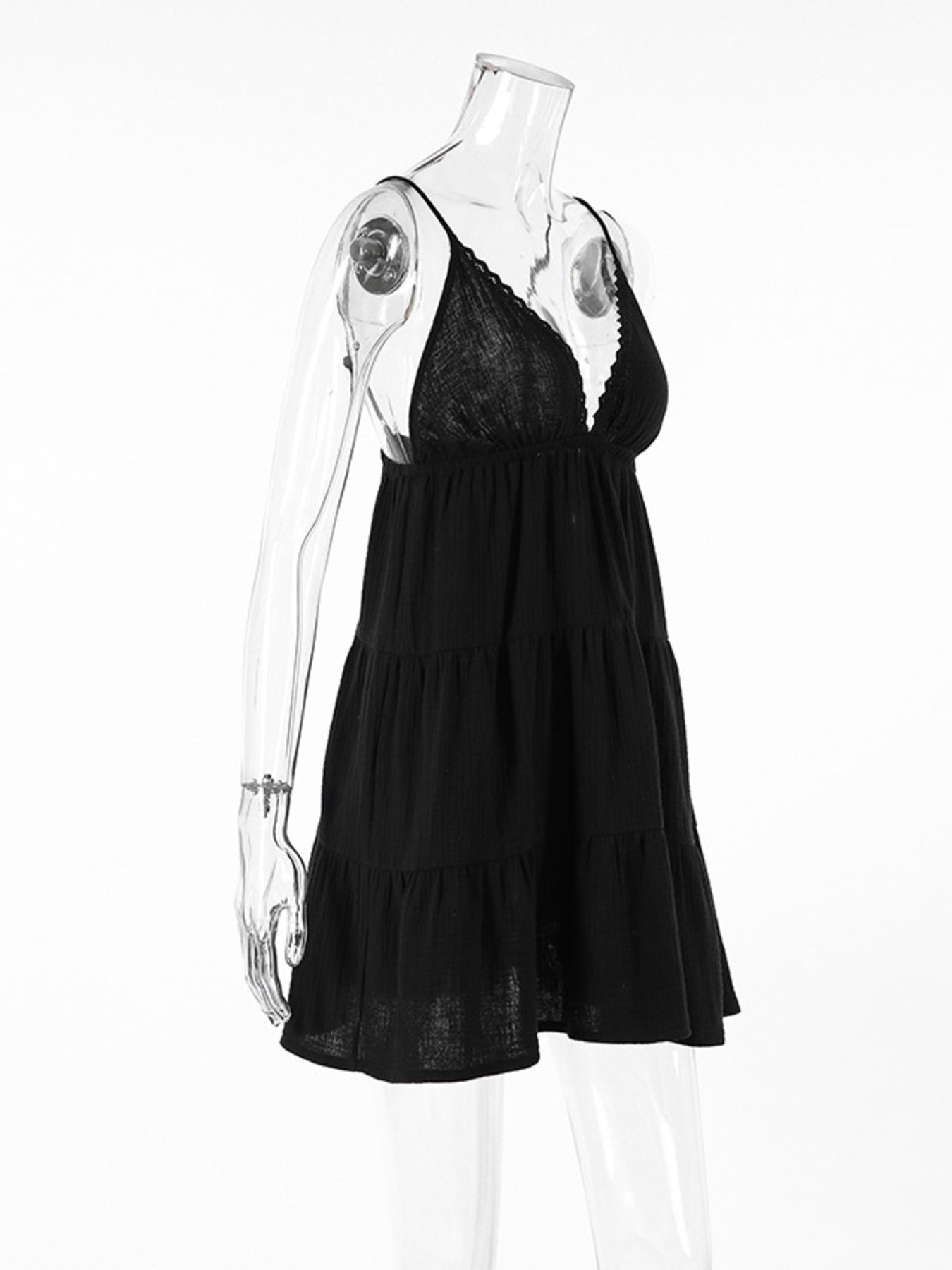Black lace nightgown on a mannequin against a white background