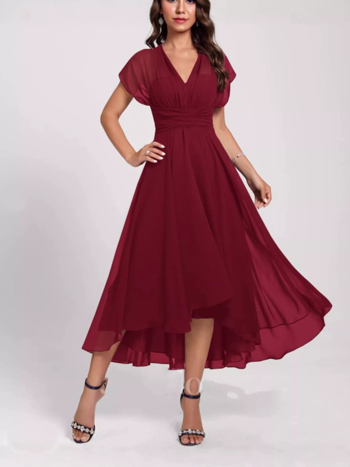 Burgundy dress worn by a model on a white background