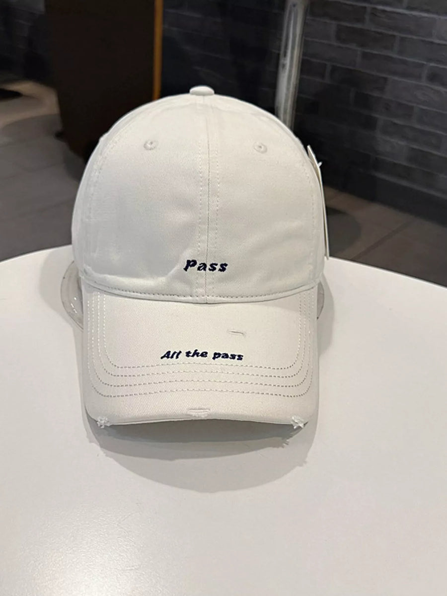 White cap with text on a white surface