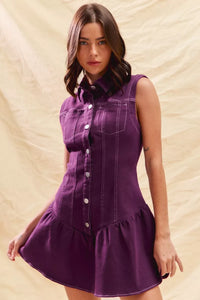 Woman wearing a purple dress against a beige background