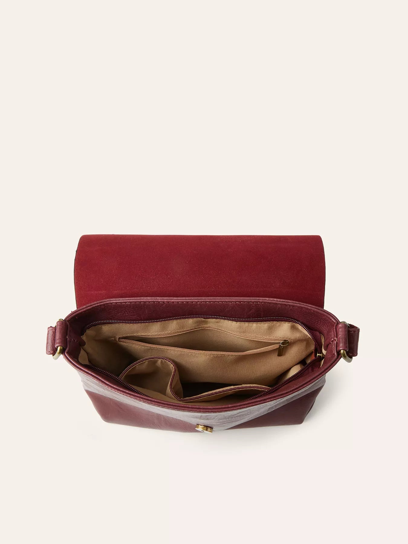 Red handbag with open lid on a white background