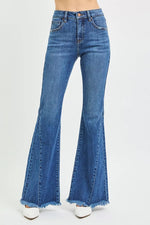 Blue flared jeans on a white background