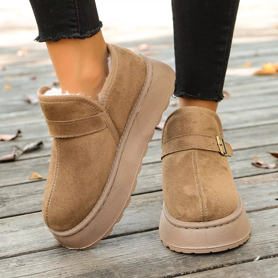 Woman showing the side of a brown Round Toe Platform Boots 