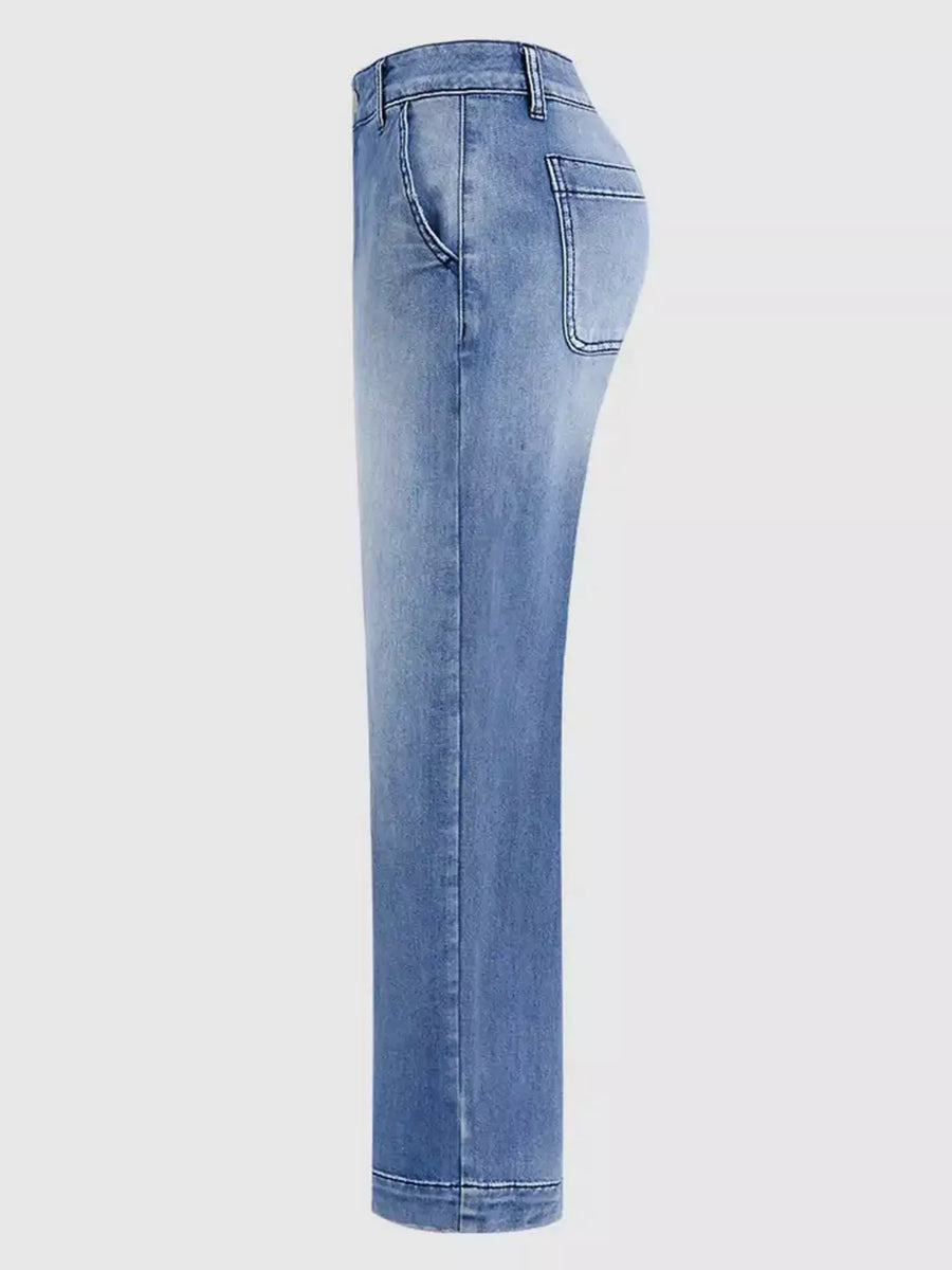 Light blue denim jeans on a white background