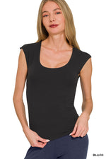 Woman wearing a black sleeveless top on a white background