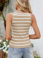 Woman wearing a beige and white striped tank top with a blurred outdoor background