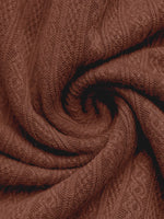 Close-up of brown fabric with a textured pattern