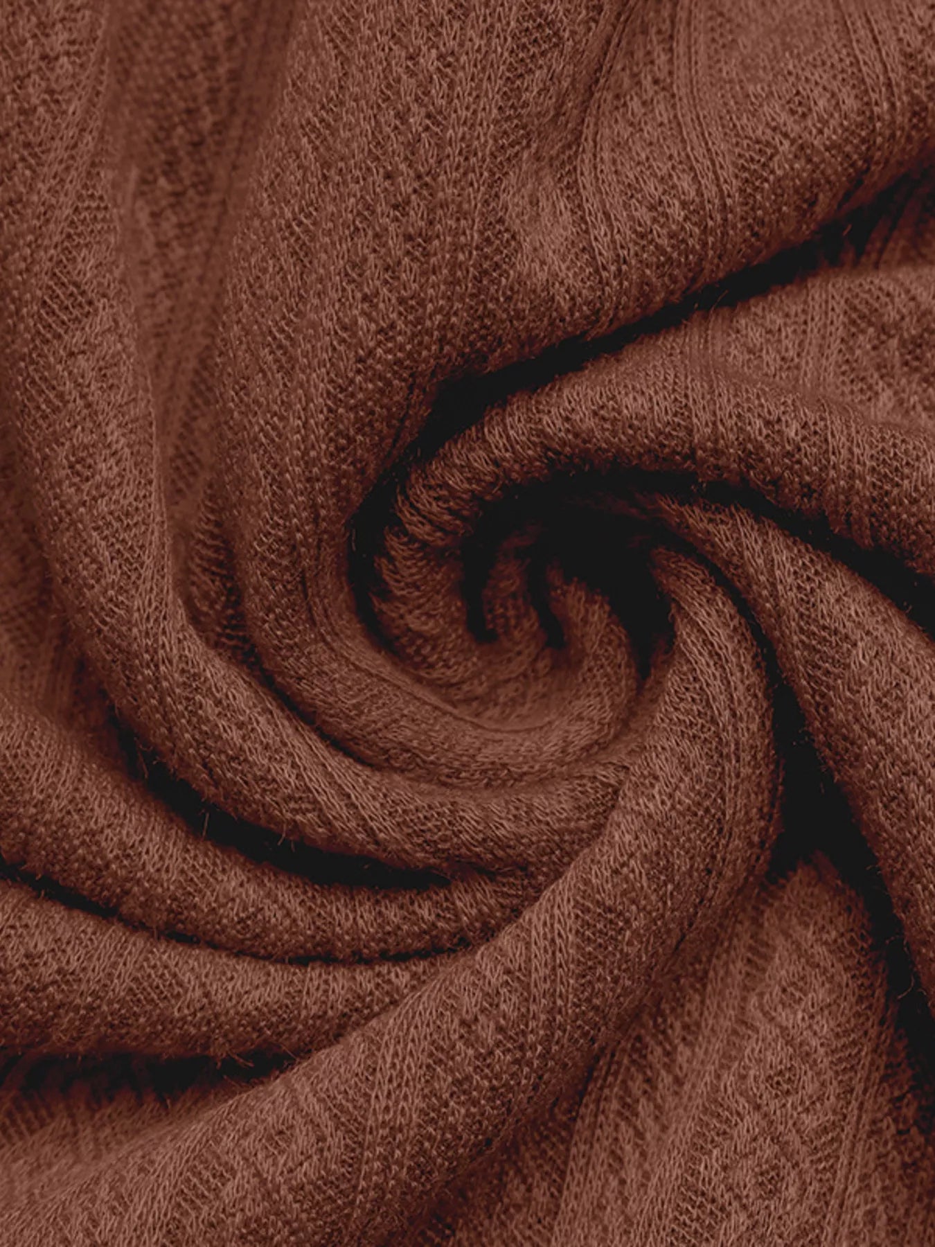 Close-up of brown fabric with a textured pattern