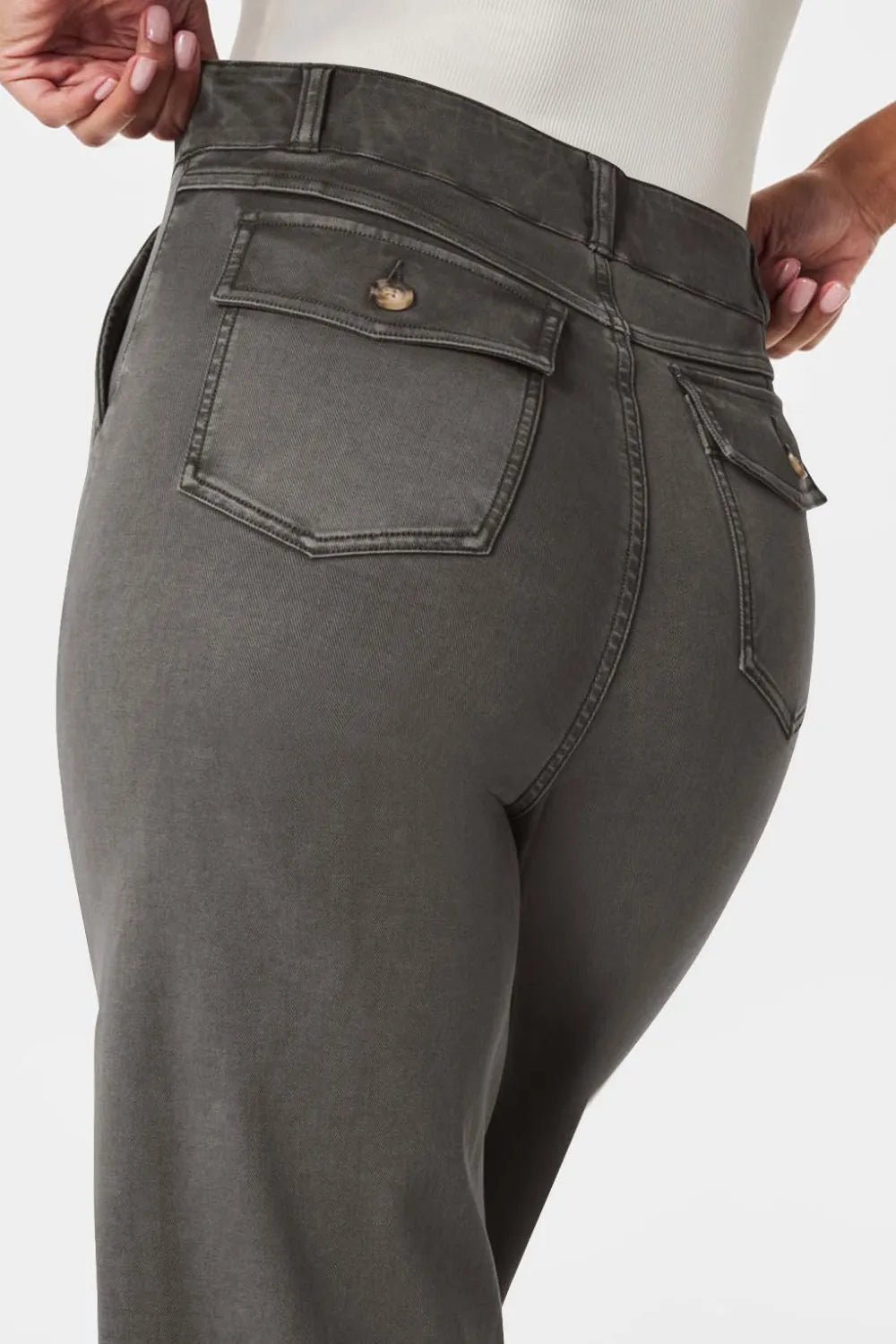 Gray pants with a focus on the waistband and pocket area against a white background