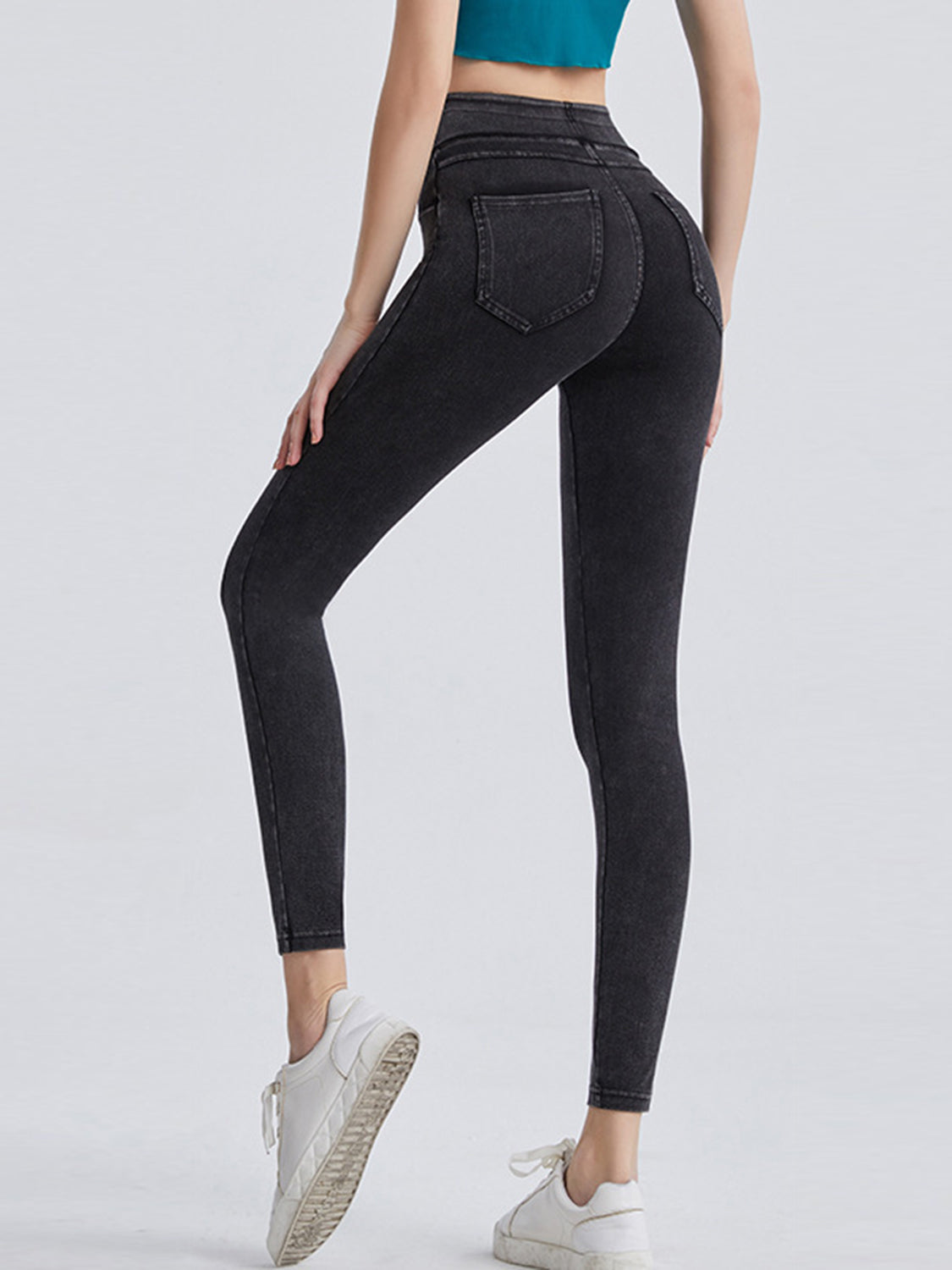Black leggings worn by a person on a white background